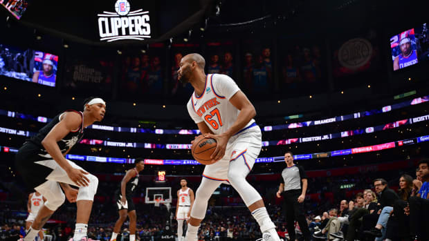 New York Knicks center Taj Gibson (67) controls the ball against Los Angeles Clippers guard Brandon Boston Jr. (4) during the second half at Crypto.com Arena.